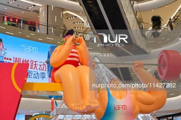 A shopping mall is turning its atrium into a cartoon arena to host a series of events for the upcoming Paris Olympic Games in Shanghai, Chin...