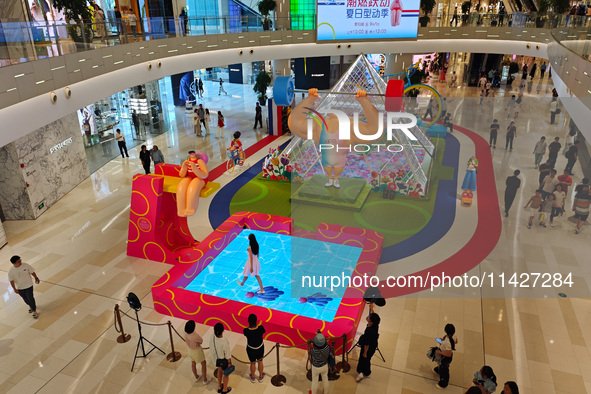 A shopping mall is turning its atrium into a cartoon arena to host a series of events for the upcoming Paris Olympic Games in Shanghai, Chin...