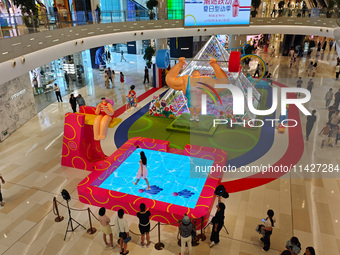 A shopping mall is turning its atrium into a cartoon arena to host a series of events for the upcoming Paris Olympic Games in Shanghai, Chin...