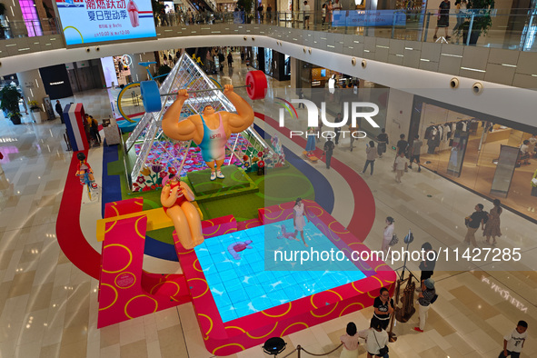 A shopping mall is turning its atrium into a cartoon arena to host a series of events for the upcoming Paris Olympic Games in Shanghai, Chin...