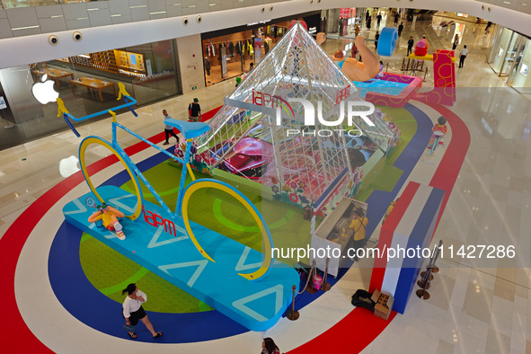 A shopping mall is turning its atrium into a cartoon arena to host a series of events for the upcoming Paris Olympic Games in Shanghai, Chin...