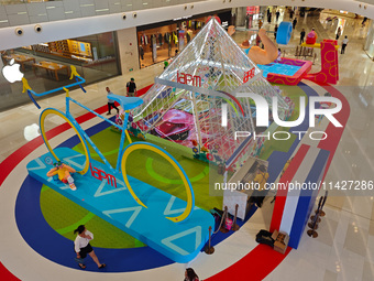 A shopping mall is turning its atrium into a cartoon arena to host a series of events for the upcoming Paris Olympic Games in Shanghai, Chin...