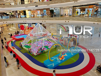 A shopping mall is turning its atrium into a cartoon arena to host a series of events for the upcoming Paris Olympic Games in Shanghai, Chin...