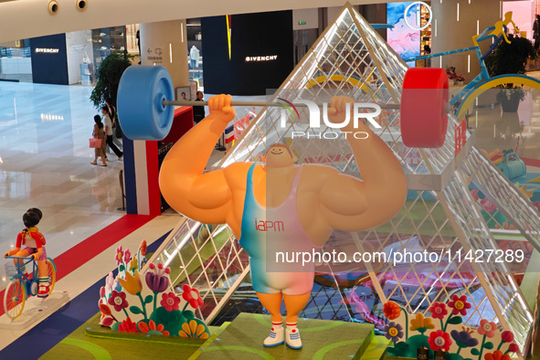 A shopping mall is turning its atrium into a cartoon arena to host a series of events for the upcoming Paris Olympic Games in Shanghai, Chin...