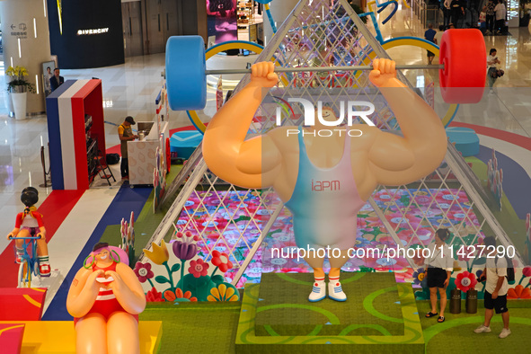 A shopping mall is turning its atrium into a cartoon arena to host a series of events for the upcoming Paris Olympic Games in Shanghai, Chin...