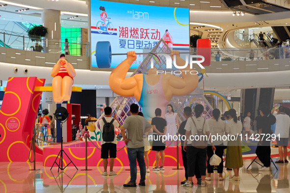 A shopping mall is turning its atrium into a cartoon arena to host a series of events for the upcoming Paris Olympic Games in Shanghai, Chin...