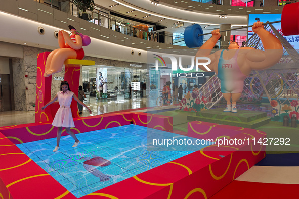 A shopping mall is turning its atrium into a cartoon arena to host a series of events for the upcoming Paris Olympic Games in Shanghai, Chin...