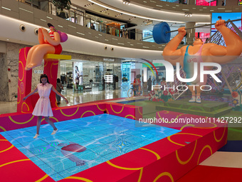 A shopping mall is turning its atrium into a cartoon arena to host a series of events for the upcoming Paris Olympic Games in Shanghai, Chin...