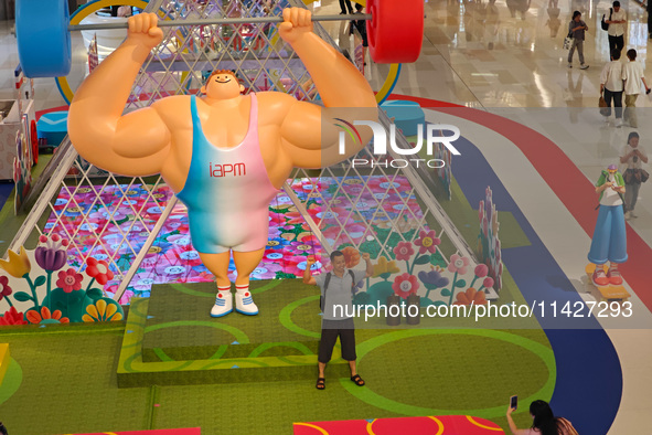 A shopping mall is turning its atrium into a cartoon arena to host a series of events for the upcoming Paris Olympic Games in Shanghai, Chin...