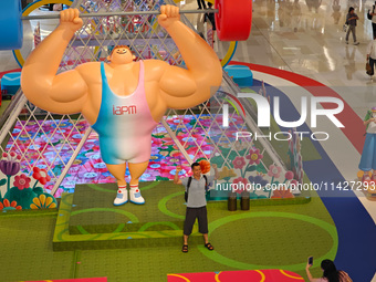 A shopping mall is turning its atrium into a cartoon arena to host a series of events for the upcoming Paris Olympic Games in Shanghai, Chin...