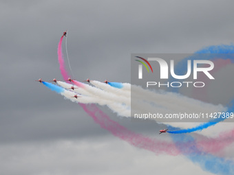 The Royal Air Force Red Arrows are performing during the Royal International Air Tattoo at RAF Fairford in Gloucestershire, England, on July...