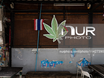 A large marijuana leaf is being displayed on the outside of a neighborhood cannabis dispensary in Bangkok, Thailand, on July 22, 2024 (