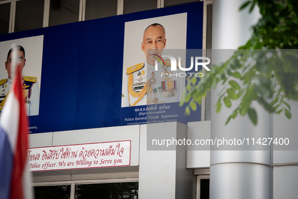 A portrait of Police General Torsak Sukvimol is hanging over the entrance to Phra Khanong Police Station in Bangkok, Thailand, on July 22, 2...