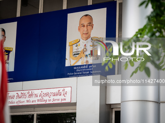 A portrait of Police General Torsak Sukvimol is hanging over the entrance to Phra Khanong Police Station in Bangkok, Thailand, on July 22, 2...