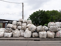 Large bags of waste are sitting outside of a sorting facility in Bangkok, Thailand, on July 22, 2024 (