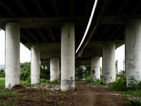 A general view is showing a waste dumping and burning ground beneath a highway in Bangkok, Thailand, on July 22, 2024 (