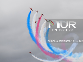 The Royal Air Force Red Arrows are performing during the Royal International Air Tattoo at RAF Fairford in Gloucestershire, England, on July...