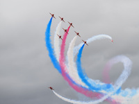 The Royal Air Force Red Arrows are performing during the Royal International Air Tattoo at RAF Fairford in Gloucestershire, England, on July...