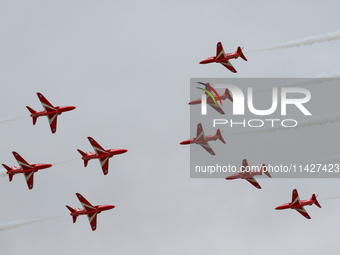 The Royal Air Force Red Arrows are performing during the Royal International Air Tattoo at RAF Fairford in Gloucestershire, England, on July...