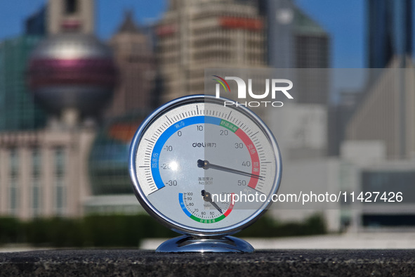 A thermometer is showing the outdoor temperature above 45?C on the Bund view terrace in Shanghai, China, on July 22, 2024. 