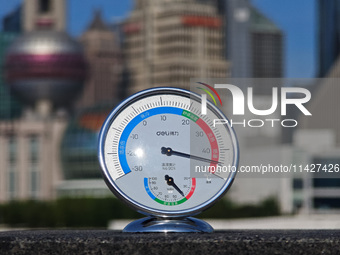 A thermometer is showing the outdoor temperature above 45?C on the Bund view terrace in Shanghai, China, on July 22, 2024. (