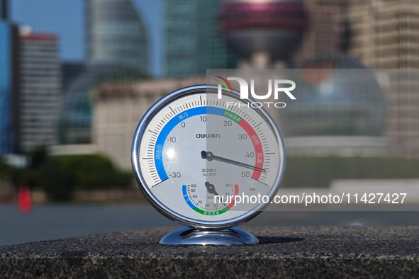 A thermometer is showing the outdoor temperature above 45?C on the Bund view terrace in Shanghai, China, on July 22, 2024. 