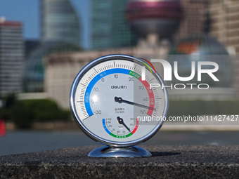 A thermometer is showing the outdoor temperature above 45?C on the Bund view terrace in Shanghai, China, on July 22, 2024. (