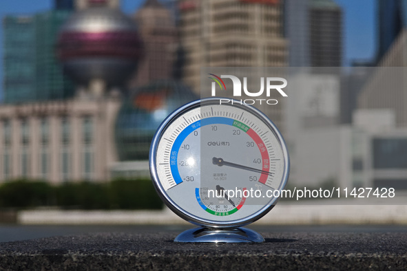 A thermometer is showing the outdoor temperature above 45?C on the Bund view terrace in Shanghai, China, on July 22, 2024. 