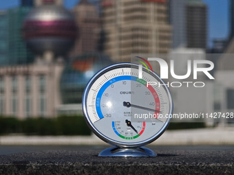 A thermometer is showing the outdoor temperature above 45?C on the Bund view terrace in Shanghai, China, on July 22, 2024. (