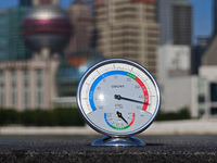 A thermometer is showing the outdoor temperature above 45?C on the Bund view terrace in Shanghai, China, on July 22, 2024. (