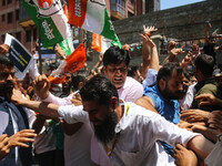 Members of the youth wing of the Indian National Congress party are shouting slogans as Indian police officers are trying to stop them durin...