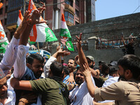 Members of the youth wing of the Indian National Congress party are shouting slogans as Indian police officers are trying to stop them durin...