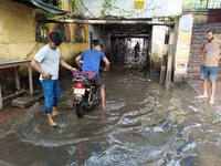 Commuters are wading through a waterlogged subway during the monsoon rain in Kolkata, India, on July 22, 2024. (