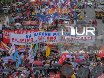 Demonstrators are carrying banners and placards and are gathering in the streets of Quezon City, Philippines, on July 22, 2024. Protestors a...