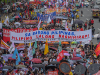 Demonstrators are carrying banners and placards and are gathering in the streets of Quezon City, Philippines, on July 22, 2024. Protestors a...