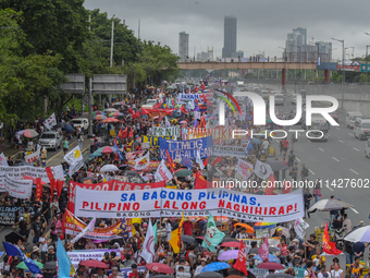 Demonstrators are carrying banners and placards and are gathering in the streets of Quezon City, Philippines, on July 22, 2024. Protestors a...