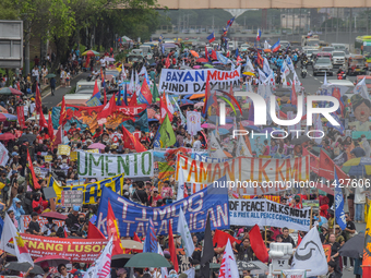 Demonstrators are carrying banners and placards and are gathering in the streets of Quezon City, Philippines, on July 22, 2024. Protestors a...