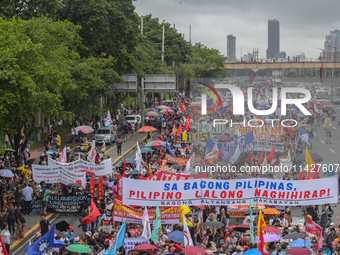 Demonstrators are carrying banners and placards and are gathering in the streets of Quezon City, Philippines, on July 22, 2024. Protestors a...