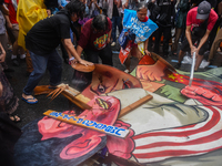 Demonstrators are carrying banners and placards and are gathering in the streets of Quezon City, Philippines, on July 22, 2024. Protestors a...