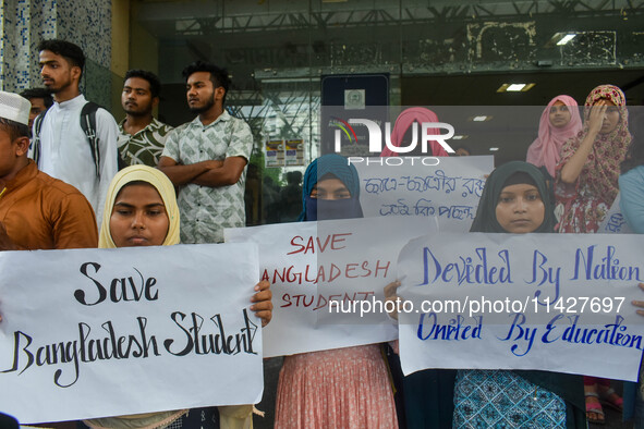 Students from Aliah University are holding posters as they are taking part in a demonstration in Kolkata, India, on July 22, 2024, demanding...