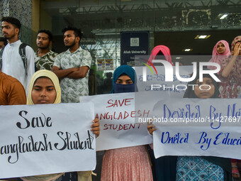 Students from Aliah University are holding posters as they are taking part in a demonstration in Kolkata, India, on July 22, 2024, demanding...