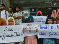 Students from Aliah University are holding posters as they are taking part in a demonstration in Kolkata, India, on July 22, 2024, demanding...