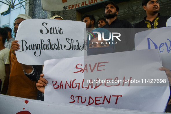 Students from Aliah University are holding posters as they are taking part in a demonstration in Kolkata, India, on July 22, 2024, demanding...