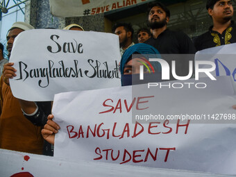 Students from Aliah University are holding posters as they are taking part in a demonstration in Kolkata, India, on July 22, 2024, demanding...