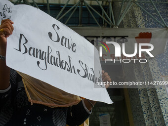 Students from Aliah University are holding posters as they are taking part in a demonstration in Kolkata, India, on July 22, 2024, demanding...