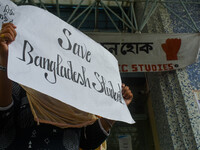 Students from Aliah University are holding posters as they are taking part in a demonstration in Kolkata, India, on July 22, 2024, demanding...