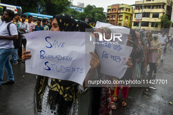 Students from Aliah University are holding posters as they are taking part in a demonstration in Kolkata, India, on July 22, 2024, demanding...