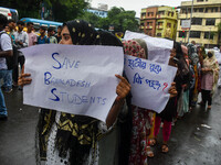 Students from Aliah University are holding posters as they are taking part in a demonstration in Kolkata, India, on July 22, 2024, demanding...