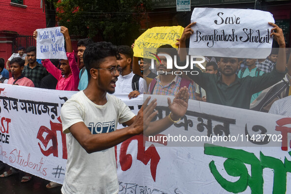 Students from Aliah University are holding posters as they are taking part in a demonstration in Kolkata, India, on July 22, 2024, demanding...