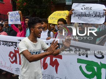 Students from Aliah University are holding posters as they are taking part in a demonstration in Kolkata, India, on July 22, 2024, demanding...